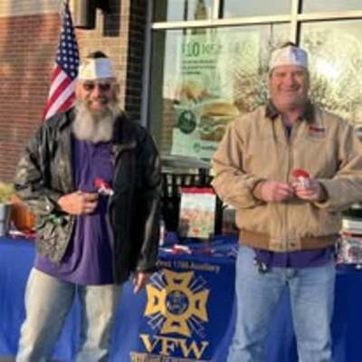 Handing out Buddy Poppies in remembrance of Veterans