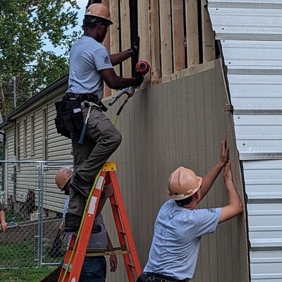 Soldiers from Fort Riley's HBI Program repair a garage for a Veteran in Ogden.